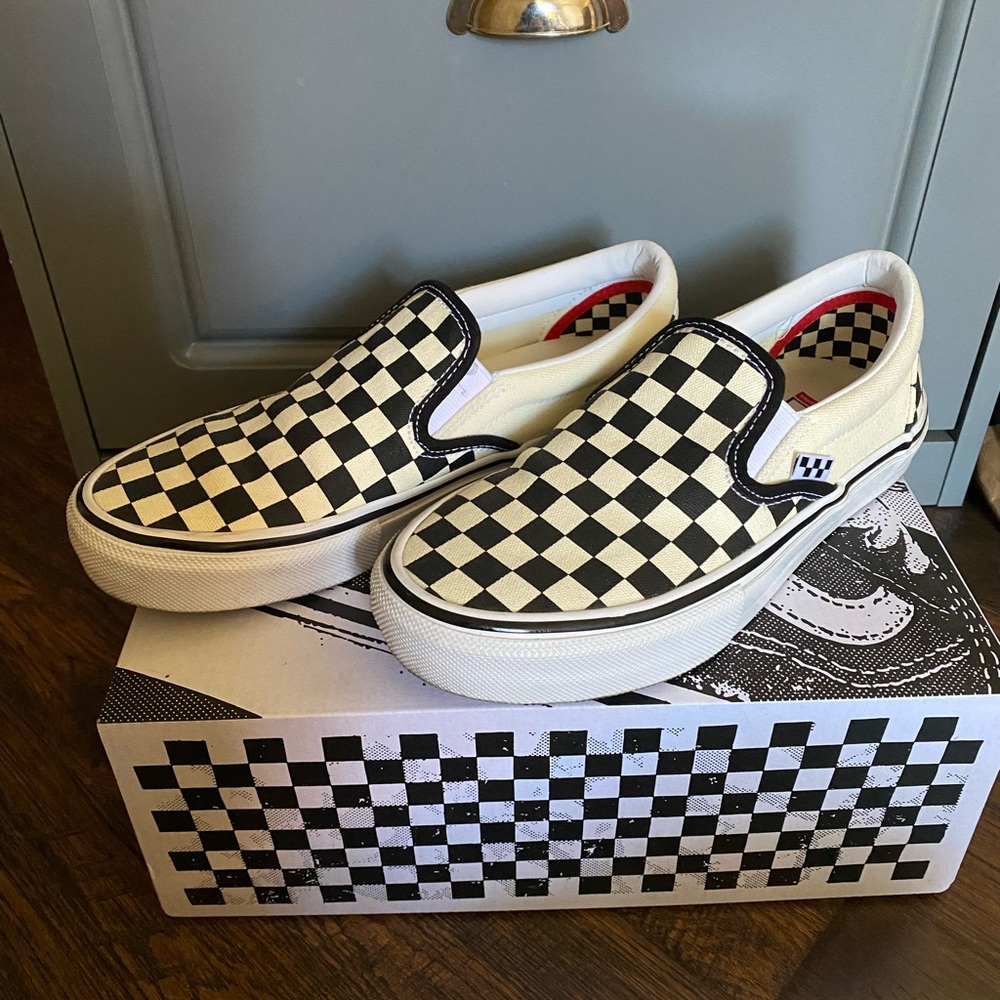 Vans slip-on checkerboard shoes. Women’s 8.5/ Men’s 6.5. Black and off-white.